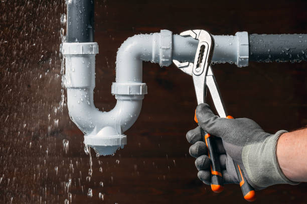 Professional Emergency Plumber technician working in Universal, IN